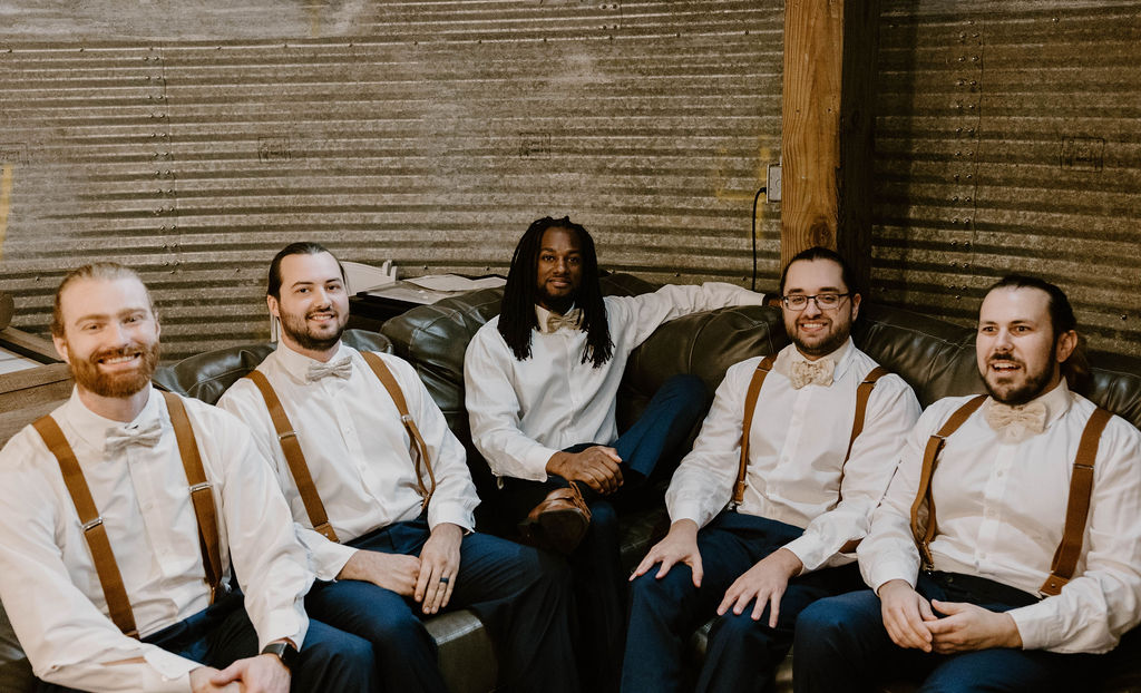 Groomsmen relaxed together in the groom's room